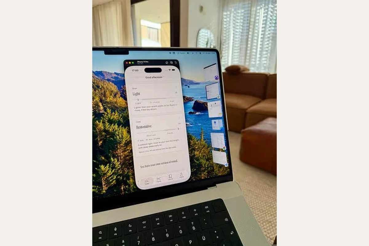 Astrea's Today screen running in the iPhone simulator on a laptop, showing a Light strain reading, a Restorative sleep reading, and one line of writing underneath.